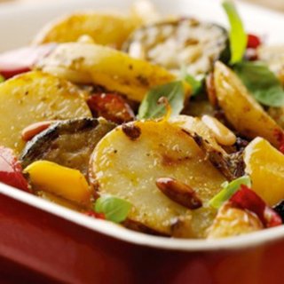 Baked Mediterranean vegetables and potatoes in a casserole dish