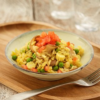A bowl of rice packed with colourful chopped veg