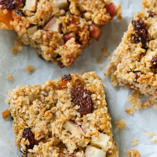 Baked oat squares with piece of apple and apricot, and sultanas embedded