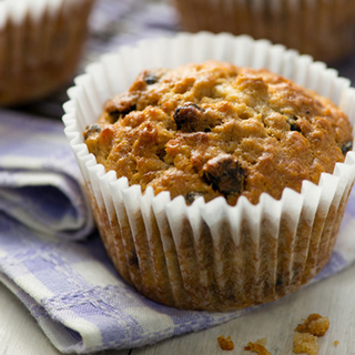 Baked blueberry and banana muffin in a wrapper.