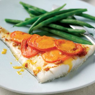 Grilled white fish topped with sliced tomato and melted cheese. Served with green beans