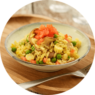 Mixed-veg rice made with tomatoes, peas, carrots and peppers.