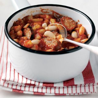 Stew of sausages, tomato, cannellini beans and potato