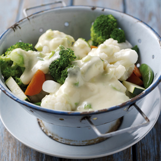 Steamed broccoli, cauliflower, carrot and courgette topped with a cheese sauce
