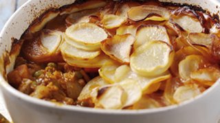 Lamb casserole topped with sliced potatoes