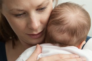mother holding a baby