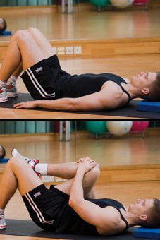 Picture of a man performing a knee to chest stretch