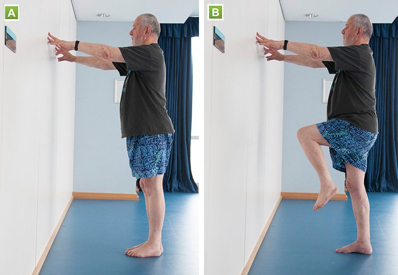 Picture of a man doing a one leg stand
