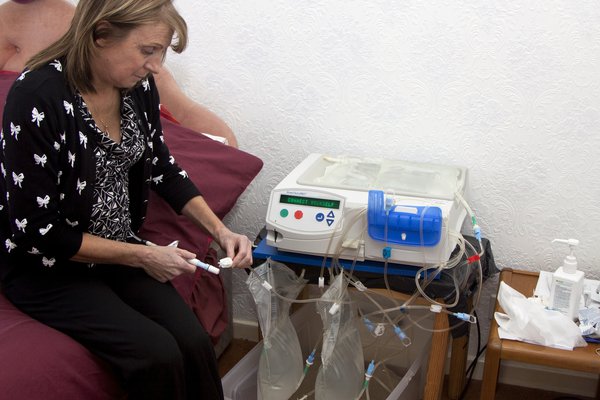 Picture of person having automated peritoneal dialysis (APD)